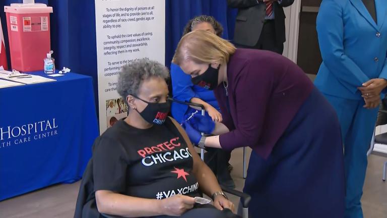 Mayor Lori Lightfoot gets her first COVID-19 vaccine shot, administered by Chicago Department of Public Health Commissioner Dr. Allison Arwady, at St. Bernard’s Hospital in Englewood on Monday, Jan. 25, 2021. (WTTW News)