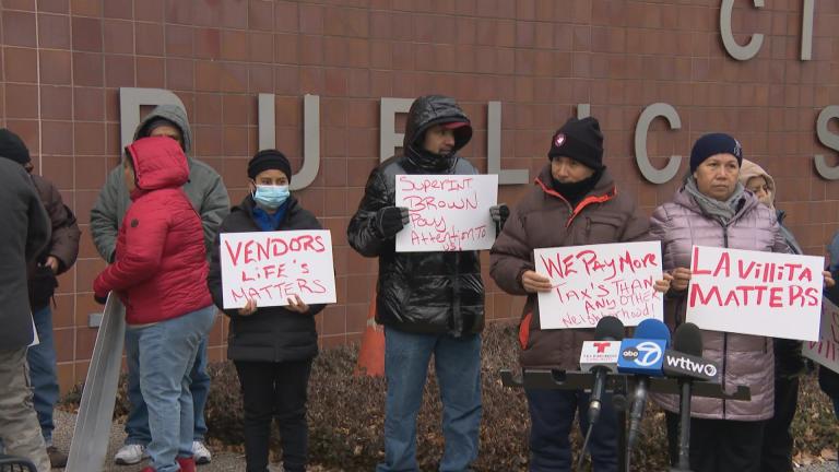 Little Village vendors call for more protection outside of Chicago Police Department headquarters on Dec. 21, 2022. (WTTW News)