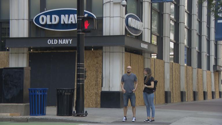 An Old Navy store in downtown Chicago is boarded up Monday, Aug. 10, 2020 after a night of looting and unrest. (WTTW News)