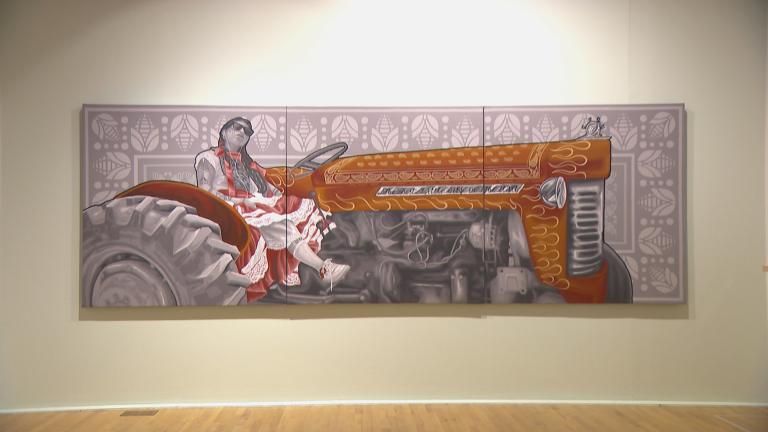 A painting is displayed in the “Los Huecos del Agua” exhibition at the National Museum of Mexican Art in Chicago. (WTTW News)