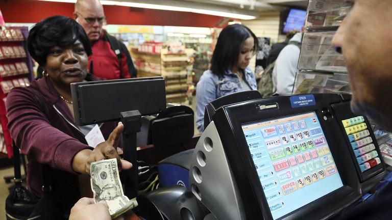 Annette Gray, left, from Valley Stream, N.Y., buys lottery tickets on Friday, Oct. 19, 2018, in New York. The estimated jackpot for Friday's Mega Millions drawing has soared to $1 billion. Gray said it's about "a dollar and a dream, but I spent ten today." (AP Photo / Bebeto Matthews) Annette Gray, left, from Valley Stream, N.Y., buys lottery tickets on Friday, Oct. 19, 2018, in New York. The estimated jackpot for Friday's Mega Millions drawing has soared to $1 billion. Gray said it's about "a dollar and a dream, but I spent ten today." (AP Photo / Bebeto Matthews)