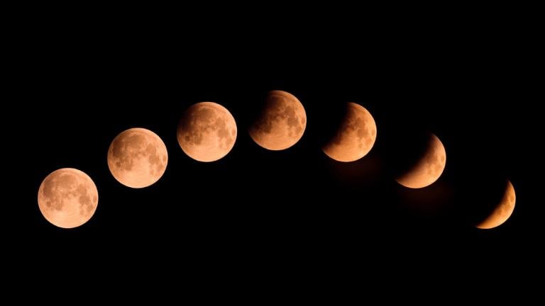 Different phases of a lunar eclipse. During a total lunar eclipse, the moon will appear blood red. (joningall / iStock)