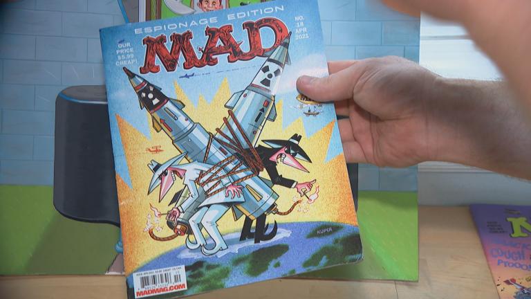 Cartoonist Johnny Sampson showcases an issue of Mad Magazine on Aug. 6, 2021. (WTTW News)