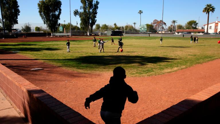 FILE- Students play ball during recess at the St. Agnes Elementary School in Phoenix, Ariz., on March 3, 2020. (AP Photo / Dario Lopez-MIlls, File)