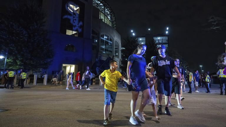Fans leave the ballpark as police respond to a shooting that took place at Guaranteed Rate Field on Friday, Aug. 25, 2023, in Chicago. Police are investigating a shooting at a White Sox baseball game at the stadium Friday night. Police said the investigation is ongoing. (Tyler Pasciak LaRiviere / Chicago Sun-Times via AP)