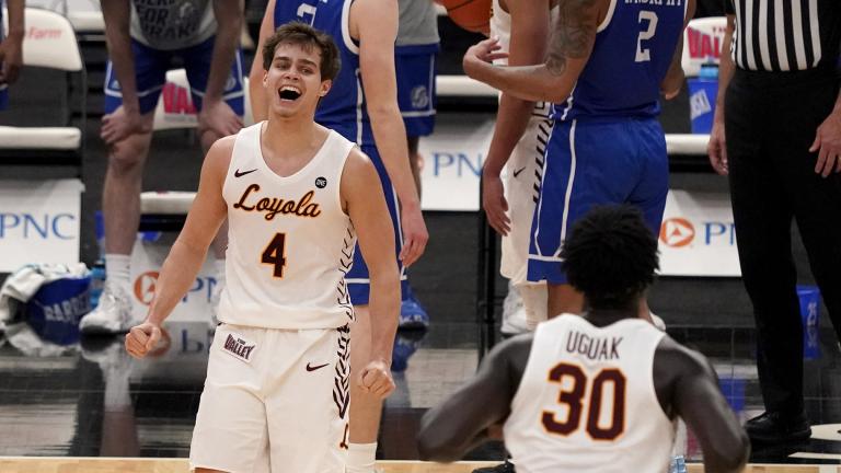 Loyola of Chicago’s Braden Norris (4) and teammate Aher Uguak (30) celebrate a 75-65 victory over Drake during the championship game in the NCAA Missouri Valley Conference men’s basketball tournament Sunday, March 7, 2021, in St. Louis. (AP Photo / Jeff Roberson)