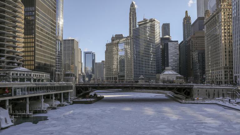 Ice covers the Chicago River on Wednesday, Jan. 30, 2019. A deadly arctic deep freeze enveloped the Midwest with record-breaking temperatures triggering widespread closures of schools and businesses. (AP Photo / Teresa Crawford)