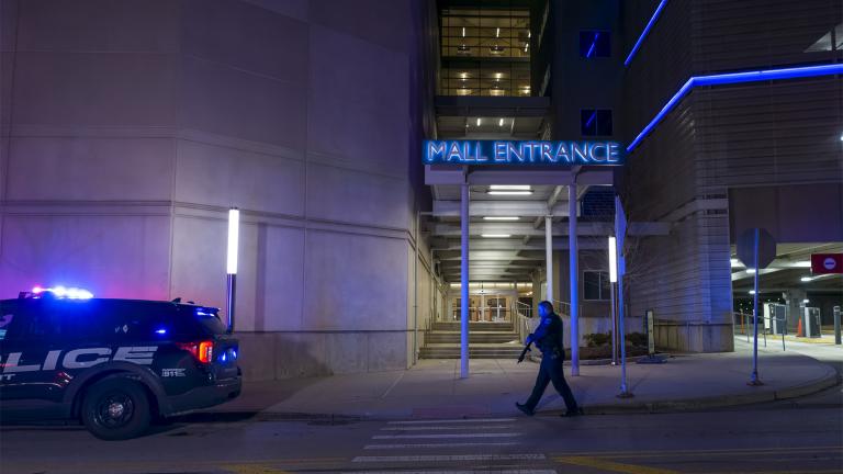 Authorities work the scene outside the Rosemont Outlet Mall where a fatal shooting occurred inside, Friday, March 25, 2022, in Rosemont, Ill. (Tyler Pasciak LaRiviere / Chicago Sun-Times via AP)