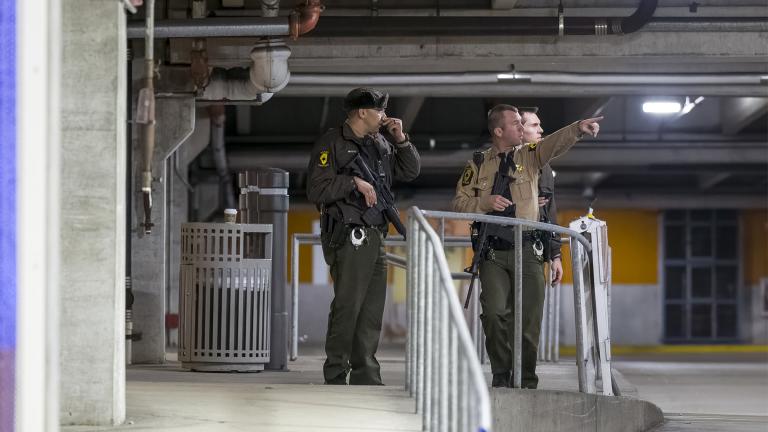 Authorities work the scene at the Rosemont Outlet Mall where a fatal shooting occurred inside, Friday, March 25, 2022, in Rosemont, Ill. (Tyler Pasciak LaRiviere / Chicago Sun-Times via AP)