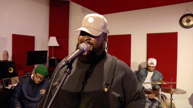 Manasseh sings with his band The Fam in December 2022. (WTTW News)