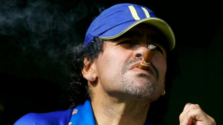 In this March 26, 2006 file photo, former soccer player Diego Maradona smokes a cigar as he watches Argentina’s first division soccer match between Boca Juniors and River Plate in Buenos Aires, Argentina. (AP Photo / Natacha Pisarenko, File) In this March 26, 2006 file photo, former soccer player Diego Maradona smokes a cigar as he watches Argentina’s first division soccer match between Boca Juniors and River Plate in Buenos Aires, Argentina. (AP Photo / Natacha Pisarenko, File)