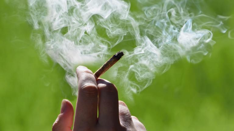 A hand holds a marijuana joint in a file photo. (Tunatura / iStock)