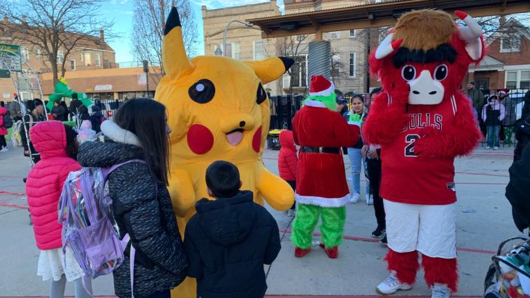 The holiday celebration at Little Village Academy was hosted by the faith-based nonprofit New Life Centers, in partnership with other local nonprofits, corporate sponsors and elected officials. (Eunice Alpasan / WTTW News)