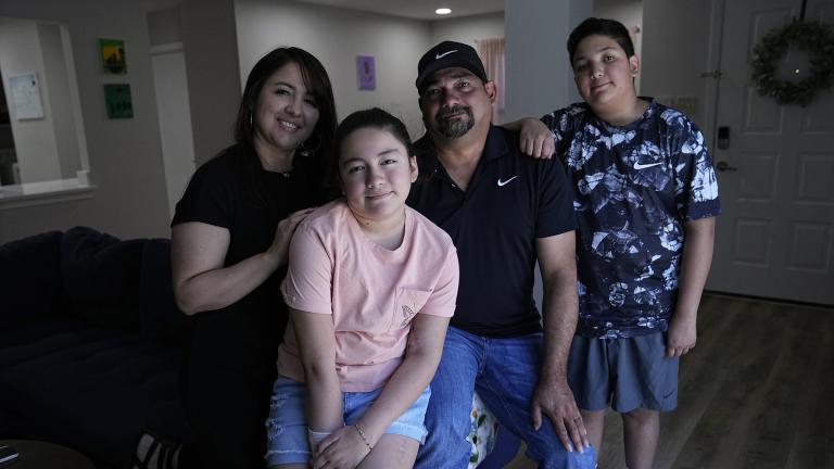 Mayah Zamora, second from left, a survivor of the mass shooting at Robb Elementary in Uvalde, Texas, poses for a photo with her mom Christina, left, dad Ruben, and brother Zach, right, at their home in San Antonio, Tuesday, June 27, 2023. (AP Photo / Eric Gay)