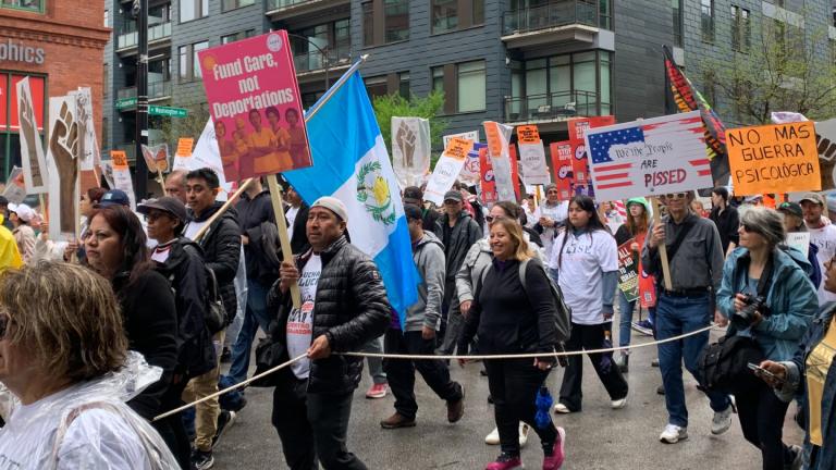 Protesters march on Washington Boulevard near Union Park to protest the Trump administration’s policies on May Day, or International Workers’ Day, on May 1, 2025. (Eunice Alpasan / WTTW News)