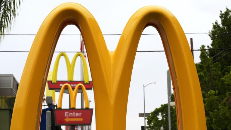 FILE - McDonald's Golden Arches signs are seen, March 31, 2026, in Los Angeles. (AP Photo/Damian Dovarganes, File)