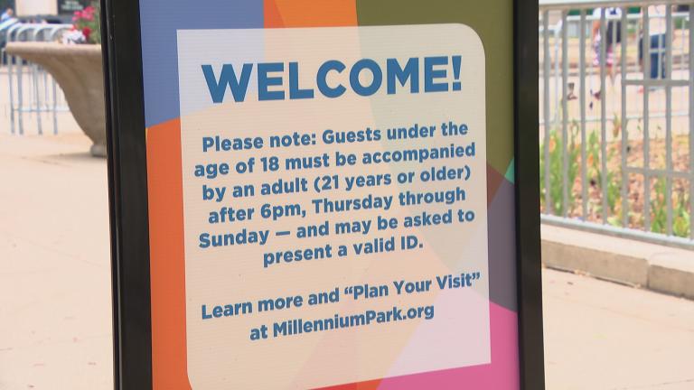A sign at Millennium Park details the new policy for teens on May 20, 2022. (WTTW News)