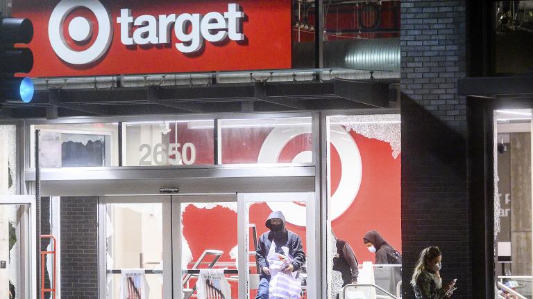 People leave a vandalized Target store in Oakland, Calif., on Saturday, May 30, 2020, during protests against the death of George Floyd, a handcuffed black man in police custody in Minneapolis. (AP Photo / Noah Berger)
