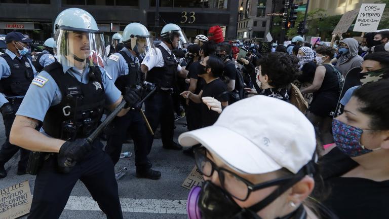 Chicago Police officers and protesters clash during a protest over the death of George Floyd in Chicago, Saturday, May 30, 2020. Floyd died after being taken into custody and restrained by Minneapolis police on Memorial Day in Minnesota. (AP Photo / Nam Y. Huh) Chicago Police officers and protesters clash during a protest over the death of George Floyd in Chicago, Saturday, May 30, 2020. Floyd died after being taken into custody and restrained by Minneapolis police on Memorial Day in Minnesota. (AP Photo / Nam Y. Huh)
