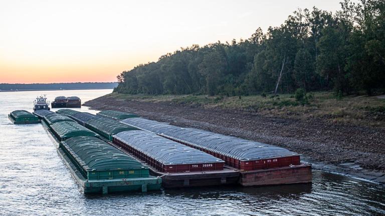 Barges idle while waiting for passage in the Mississippi River near Vicksburg, Miss., on Tuesday, Oct. 4, 2022. (Thomas Berner via AP)