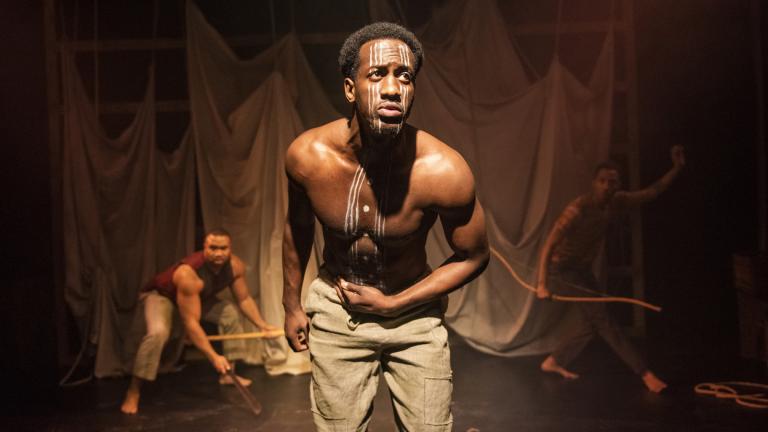 David Goodloe, center, with Lewon Johns, back left, and Michael Turrentine in Griffin Theatre Company’s Midwest premiere of “Mlima’s Tale.” (Photo by Michael Brosilow)