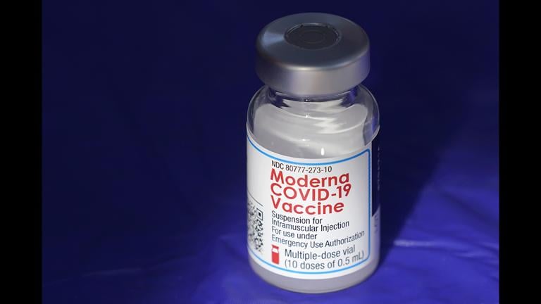 In this March 4, 2021 file photo, a vial of the Moderna COVID-19 vaccine rests on a table at a drive-up mass vaccination site in Puyallup, Wash., south of Seattle. (AP Photo / Ted S. Warren, File)