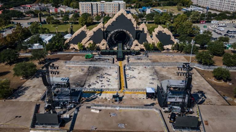 The Astroworld main stage where Travis Scott was performing Friday evening where a surging crowd killed eight people, sits full of debris from the concert, in a parking lot at NRG Center on Monday, Nov. 8, 2021, in Houston. (Mark Mulligan / Houston Chronicle via AP)