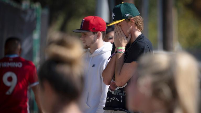 A man cries at a memorial for the victims of the Astroworld music festival in Houston on Sunday, Nov. 7, 2021. (AP Photo / Robert Bumsted)