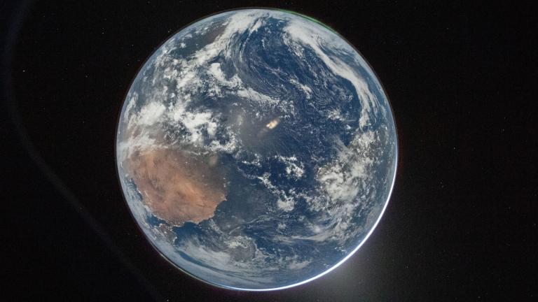 This image provided by NASA shows a view of Earth taken by NASA astronaut and Artemis II Commander Reid Wiseman from of the Orion spacecraft's window after completing the translunar injection burn on April 2, 2026. (NASA via AP)