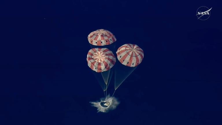 In this image from video provided by NASA, the Artemis II Orion capsule splashes down in the Pacific Ocean, on Friday, April 10, 2026. (NASA via AP)