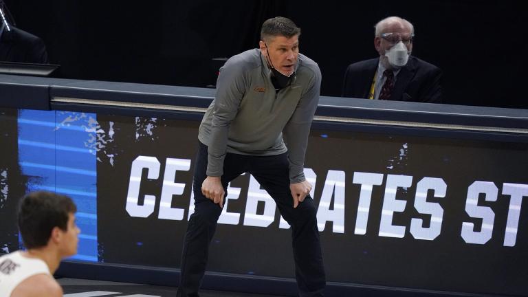 Loyola Chicago head coach Porter Moser watches from the bench during the first half of a Sweet 16 game against Oregon State in the NCAA men’s college basketball tournament at Bankers Life Fieldhouse, Saturday, March 27, 2021, in Indianapolis. (AP Photo / Jeff Roberson)