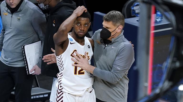 Loyola Chicago head coach Porter Moser, right, consoles guard Marquise Kennedy after a Sweet 16 game against Oregon State in the NCAA men’s college basketball tournament at Bankers Life Fieldhouse, Saturday, March 27, 2021, in Indianapolis. Oregon State won 65-58. (AP Photo / Darron Cummings)