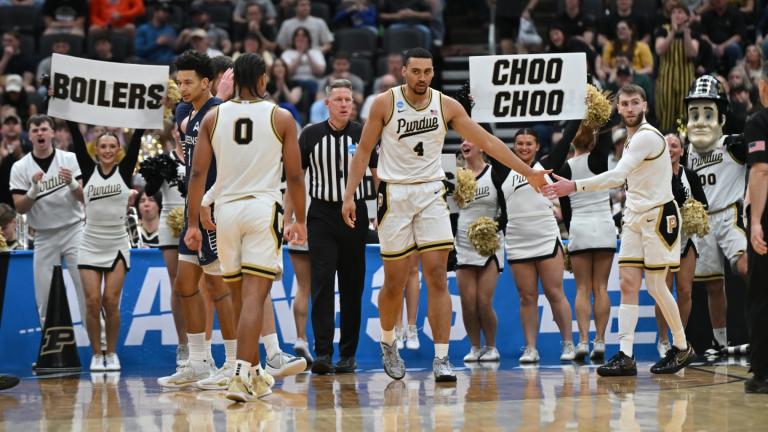 Purdue's Trey Kaufman-Renn (4) celebrates with teammate Braden Smith, right, and C.J. Cox (0) during the second half in the first round of the NCAA college basketball tournament against Queens University, Friday, March 20, 2026, in St. Louis. (AP Photo / Ali Overstreet)