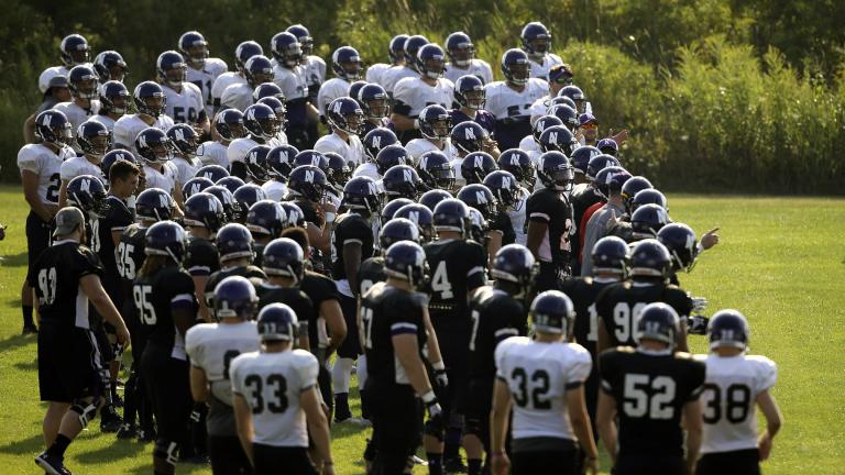 Northwestern football players gather during practice at the University of Wisconsin-Parkside campus in Kenosha, Wisc., in this Monday, Aug. 17, 2015, file photo. (AP Photo / Jeffrey Phelps, File)