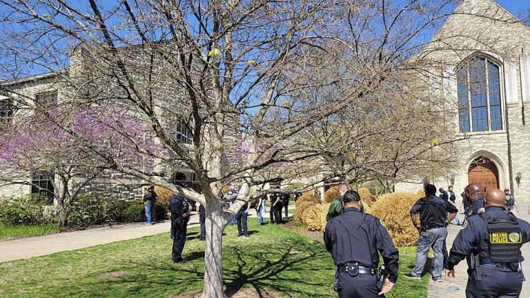 This photo provided by the Metro Nashville Police Department shows officers at an active shooter event that took place at Covenant School, Covenant Presbyterian Church, in Nashville, Tenn. Monday, March 27, 2023. Authorities say the suspect in a shooting at a private Christian school in Nashville is dead. (Metro Nashville Police Department via AP)