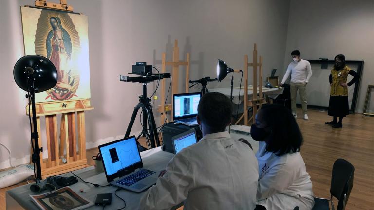 Researchers from the Center for Scientific Studies in the Arts examine works in the National Museum of Mexican Art to learn more about their history, April 23, 2021. (Marc Vitali / WTTW News)