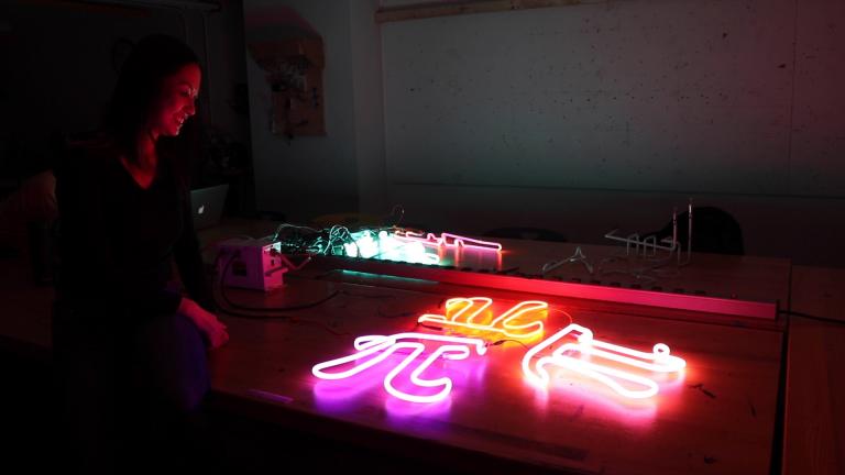 Neon artist Audra Jacot lights up one of her works at the School of the Art Institute of Chicago’s Light Lab.