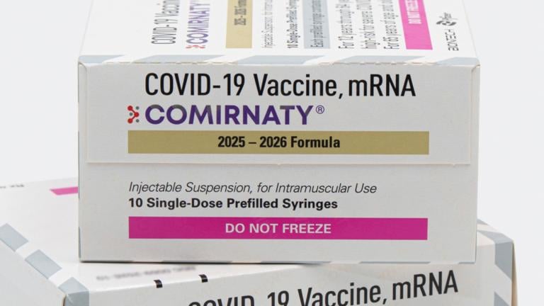 This photo provided by Pfizer in August 2025 shows boxes for the updated COVID-19 vaccine Comirnaty. (Pfizer via AP)