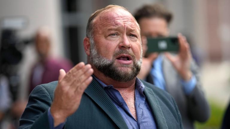 Alex Jones speaks to the media after arriving at the federal courthouse for a hearing in front of a bankruptcy judge, June 14, 2024, in Houston. (AP Photo / David J. Phillip, file)