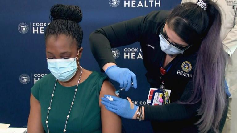 Illinois Department of Public Health Director Dr. Ngozi Ezike receives her first dose of the Pfizer COVID-19 vaccine on Tuesday, Jan. 12, 2021 at the North Riverside Health Center. (WTTW News)