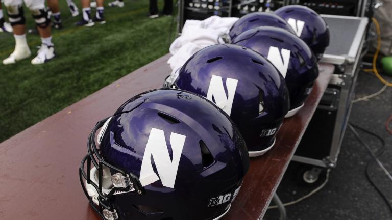 FILE - Northwestern helmets sit on a table during an NCAA college football against Stanford in Evanston, Ill, Saturday, Sept. 5, 2015. (Matt Marton / AP Photo, File)