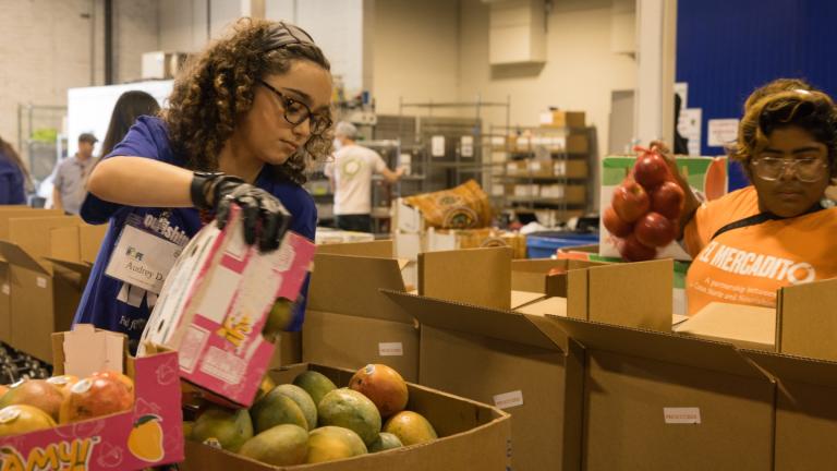 Volunteers work at Nourishing Hope’s headquarters on Aug. 17, 2023. (Courtesy of Alyssa Schukar for Nourishing Hope)