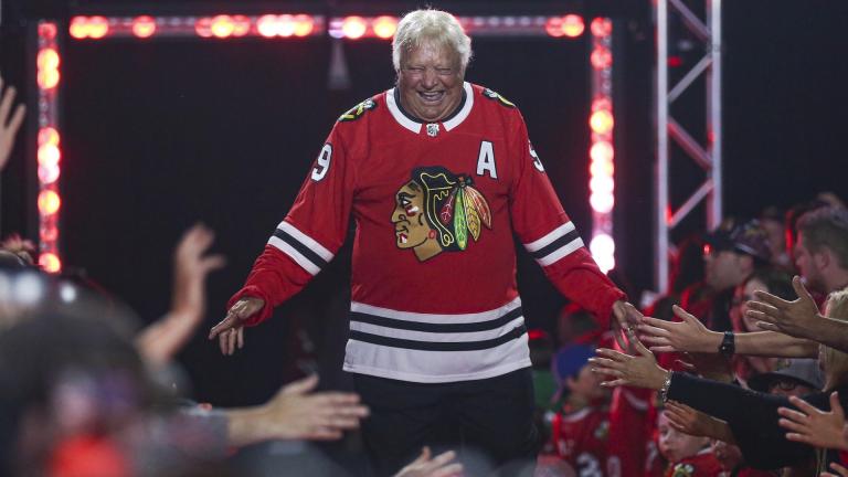 Former Chicago Blackhawks player Bobby Hull is introduced to fans during the NHL hockey team's convention in Chicago, July 26, 2019. Hull, a Hall of Fame forward who helped the Blackhawks win the 1961 Stanley Cup Final, has died. He was 84. (AP Photo/Amr Alfiky, file)