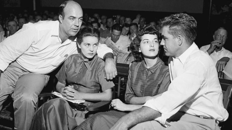 In this Sept. 23, 1955, file photo, J.W. Milam, left, his wife, second from left, Roy Bryant, far right, and his wife, Carolyn Bryant, sit together in a courtroom in Sumner, Miss. (AP Photo / File)