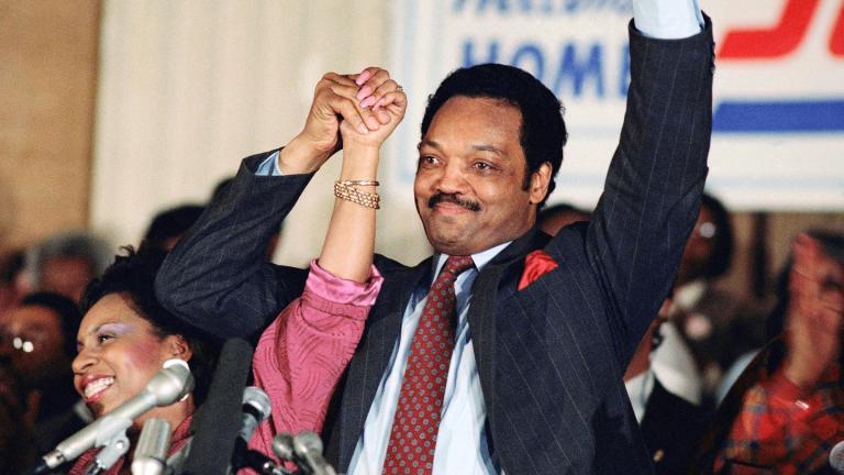Democratic presidential hopeful Jesse Jackson with his wife, Jacqueline, salutes the cheering crowd at Operation Push in Chicago, March 10, 1988. (AP Photo/Fred Jewell, File)