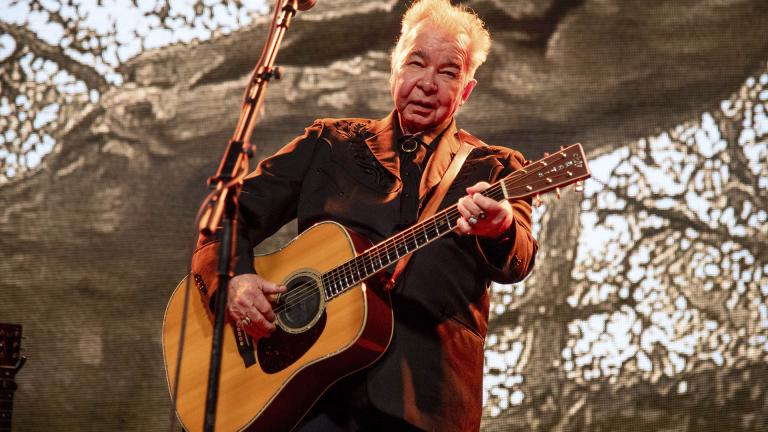 This June 15, 2019 file photo shows John Prine performing at the Bonnaroo Music and Arts Festival in Manchester, Tennessee. (Photo by Amy Harris / Invision / AP, File)