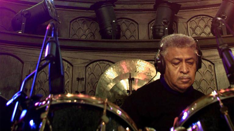 Blues drummer Sam Lay sets up below stained glass where the altar used to be at the former First Christian Church that is now the Blue Heaven Studios in Salina, Kan., Jan. 27, 2000.  (AP Photo / Cliff Schiappa, file)