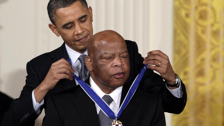 In this Feb. 15, 2011, file photo, President Barack Obama presents a 2010 Presidential Medal of Freedom to U.S. Rep. John Lewis, D-Ga., during a ceremony in the East Room of the White House in Washington. (AP Photo / Carolyn Kaster, File)
