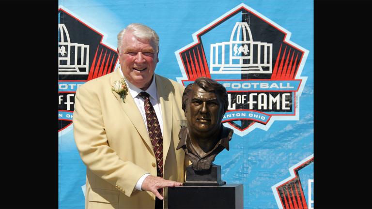 Broadcaster and former Oakland Raiders coach John Madden poses with his bust after enshrinement into the Pro Football Hall of Fame Saturday, Aug. 5, 2006, in Canton, Ohio.  (AP Photo / Mark Duncan, File)