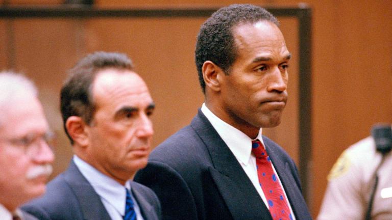 O.J. Simpson stands as he listens to Municipal Judge Kathleen Kennedy-Powell as she reads her decision to hold him over for trial on July 8, 1994, in connection with the June 12 slayings of his ex-wife Nicole Brown Simpson and Ronald Goldman. (AP Photo / Eric Draper, Pool, File)